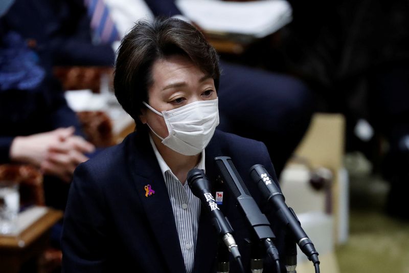 &copy; Reuters. Japan’s Olympics Minister Seiko Hashimoto wears a protective face mask as she attends an upper house parliamentary session