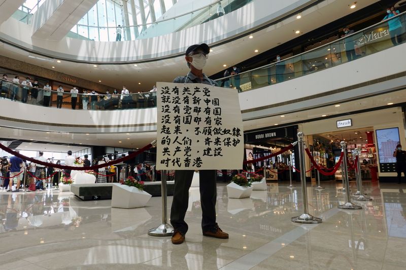 &copy; Reuters. FILE PHOTO: Pro-democracy demonstrator takes part in a lunchtime protest against the national security law, at a shopping mall in Hong Kong