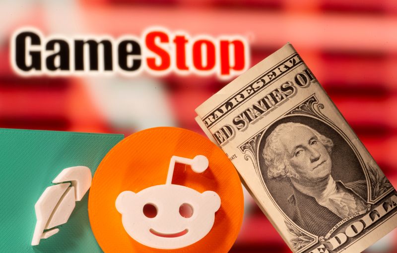 &copy; Reuters. FILE PHOTO: A 3d printed Robinhood and Reddit logos are seen near one dollar banknotes in front of displayed GameStop logo