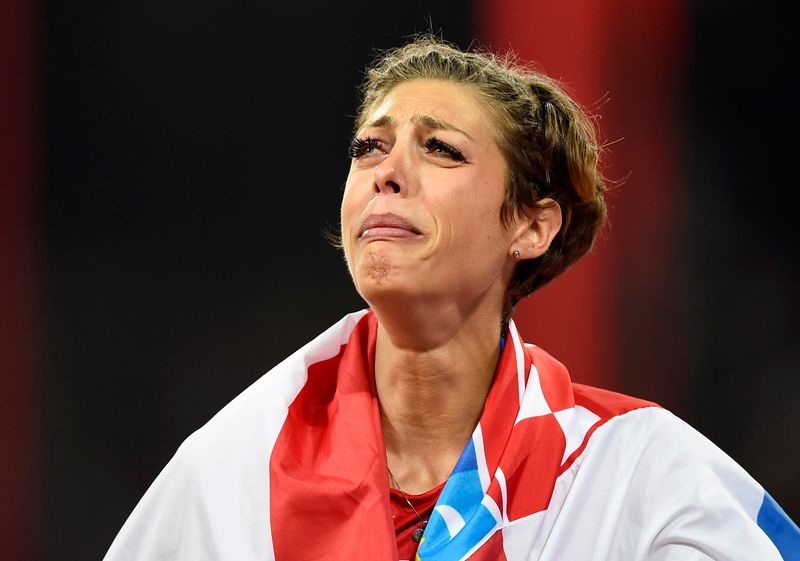 &copy; Reuters. Second placed Vlasic of Croatia cries after competing in the women&apos;s high jump final during the 15th IAAF World Championships at the National Stadium in Beijing