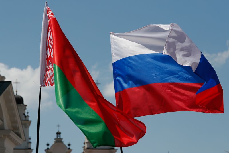 &copy; Reuters. Belarusian and Russian national flags fly during &quot;Day of multinational Russia&quot; event in central Minsk