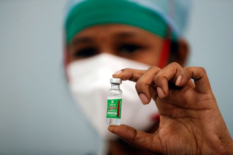 &copy; Reuters. FILE PHOTO: A nurse displays a vial of COVISHIELD, the AstraZeneca COVID-19 vaccine manufactured by Serum Institute of India, in Mumbai