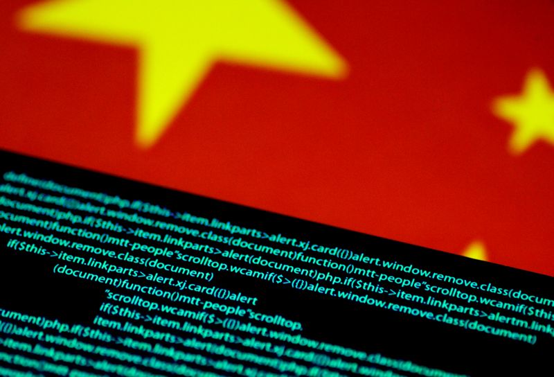 &copy; Reuters. FILE PHOTO: Illustration photo of computer code on a screen above a Chinese flag