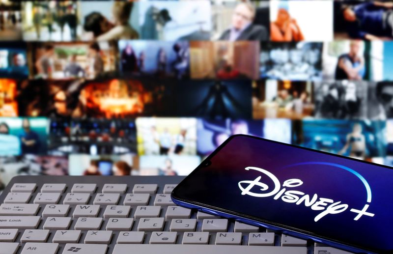 &copy; Reuters. FILE PHOTO: Smartphone with displayed &quot;Disney&quot; logo is seen on the keyboard in this illustration