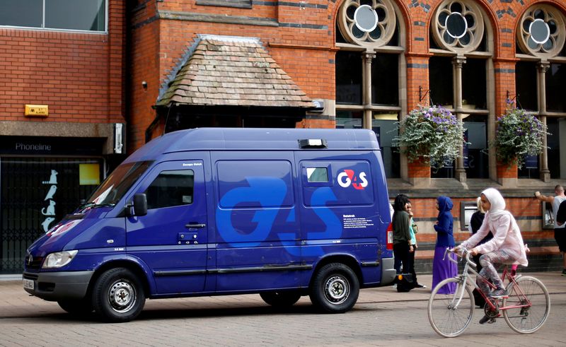 © Reuters. FILE PHOTO: File photo of a G4S security van parked outside a bank in Loughborough