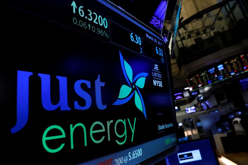 &copy; Reuters. The company logo and trading information for Just Energy Group Inc. is displayed on a screen on the floor of the NYSE