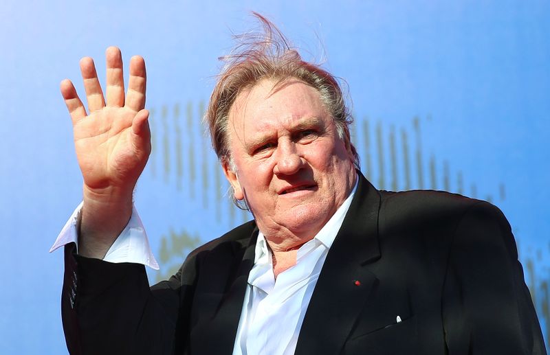 &copy; Reuters. Gerard Depardieu waves as he arrives during a red carpet event for the movie &quot;Novecento- Atto Primo&quot; at the 74th Venice Film Festival in Venice