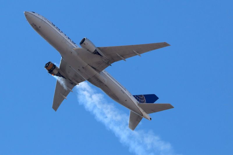 &copy; Reuters. FILE PHOTO: United Airlines flight UA328 returns to Denver International Airport with its starboard engine on fire after it called a Mayday alert