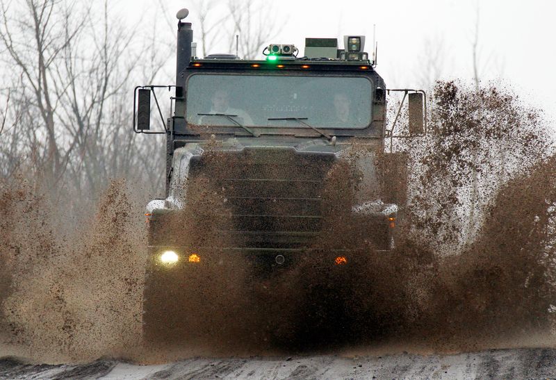 &copy; Reuters. An Oshkosh truck using the TerraMax autonomous driving system drives along a mud-soaked test course outside of Pittsburgh