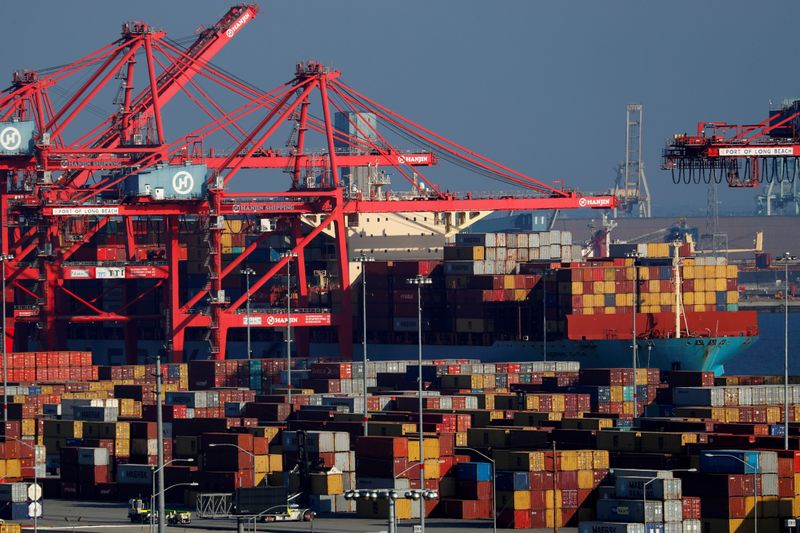 &copy; Reuters. FILE PHOTO: Ships and shipping containers are pictured at the port of Long Beach in Long Beach, California