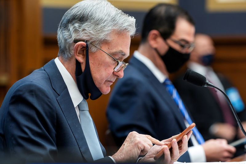 &copy; Reuters. FILE PHOTO: Fed&apos;s Powell is pictured preparing to speak before a House committee in December