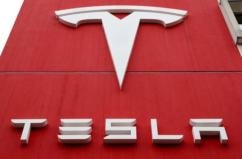 © Reuters. FILE PHOTO: A Tesla sign at the carmaker's branch office in Bern, Switzerland