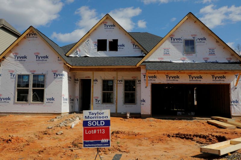 &copy; Reuters. A home under construction stands behind a &quot;sold&quot; sign in a new development in York County, South Carolina