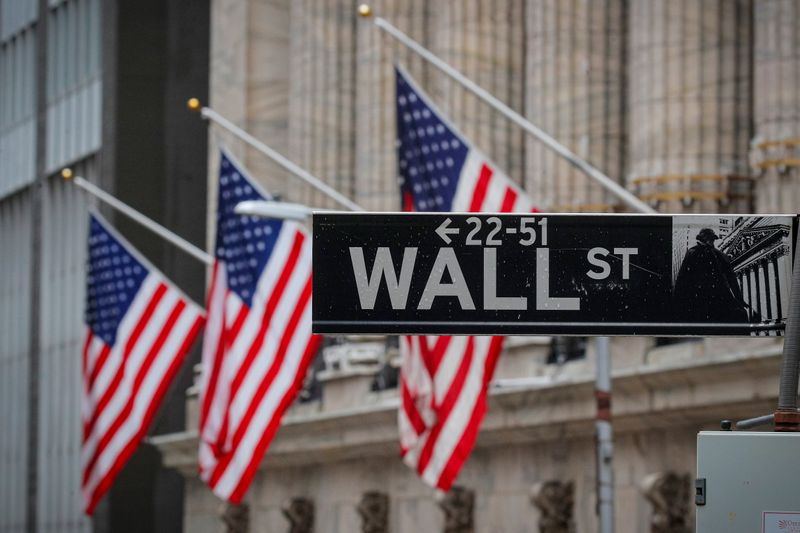 &copy; Reuters. The Wall St. sign is seen outside the NYSE in New York