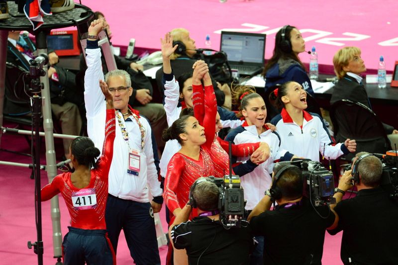 &copy; Reuters. Coach John Geddert reacts after the Olympic women&apos;s team gymnastics finals in London