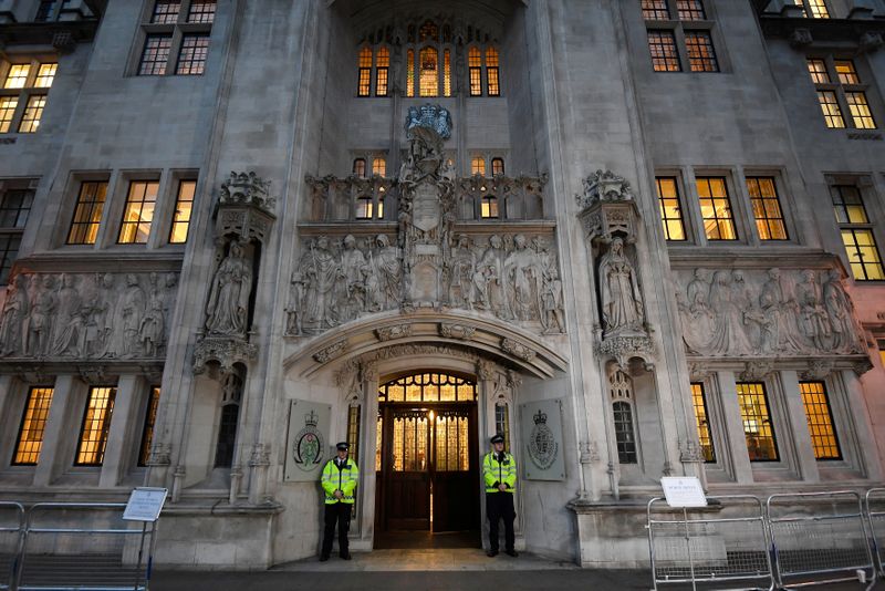 &copy; Reuters. FILE PHOTO: Police officers stand on duty outside the Supreme Court in Parliament Square, central London