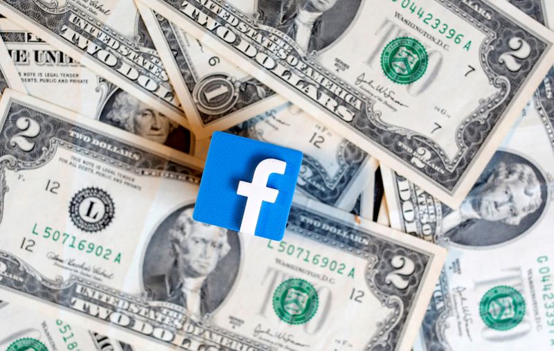 &copy; Reuters. FILE PHOTO: FILE PHOTO: A 3-D printed Facebook logo is seen on U.S. dollar banknotes in this illustration picture