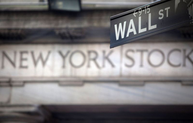 © Reuters. FILE PHOTO: A Wall Street sign outside the New York Stock Exchange