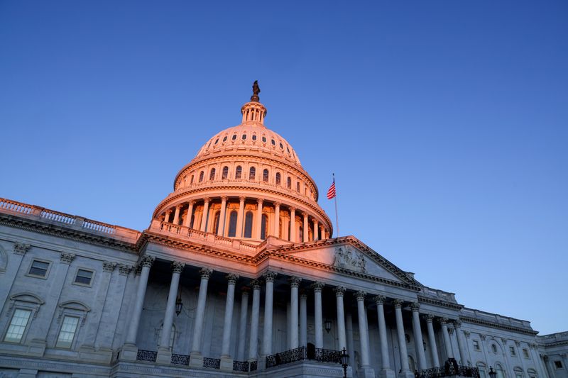 &copy; Reuters. FILE PHOTO: The sun rises on the U.S. Capitol dome before Joe Biden&apos;s presidential inauguration in Washington