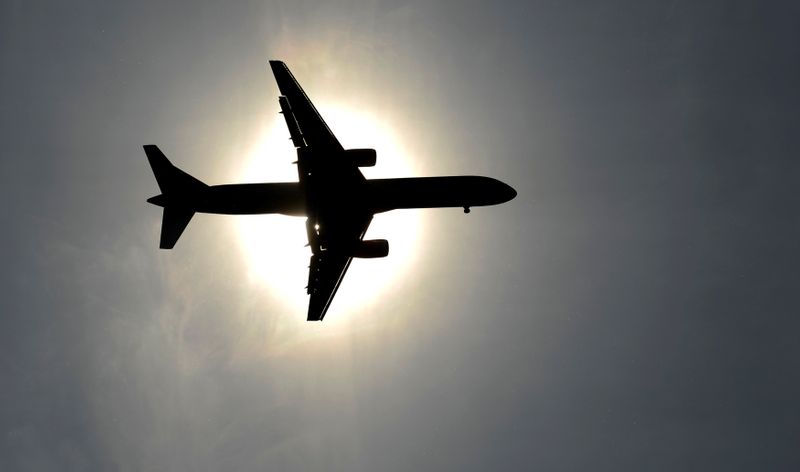 &copy; Reuters. FILE PHOTO: Plane approaching Leeds Bradford airport passes in front of the sun during the second test cricket match between England and New Zealand in Leeds