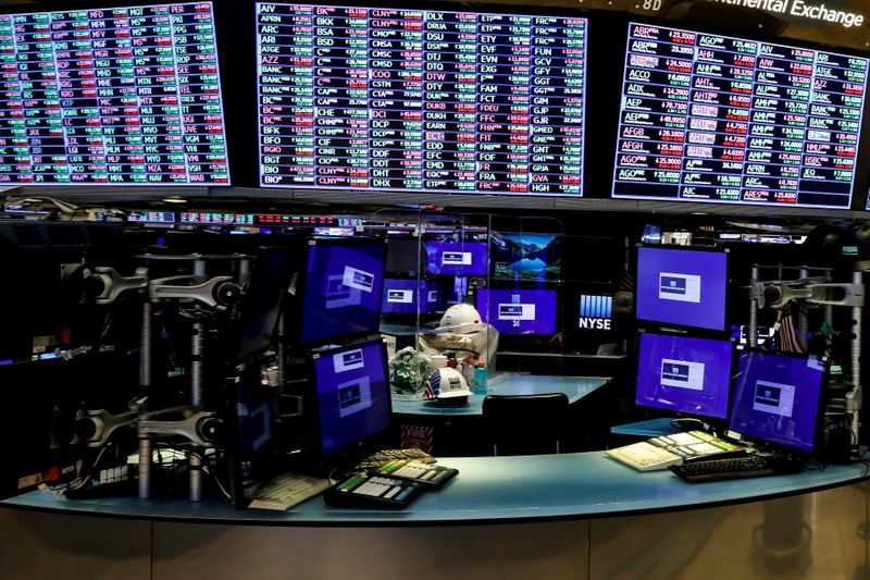© Reuters. FILE PHOTO: Dividers are seen inside a trading post on the trading floor as preparations are made for the return to trading at the NYSE