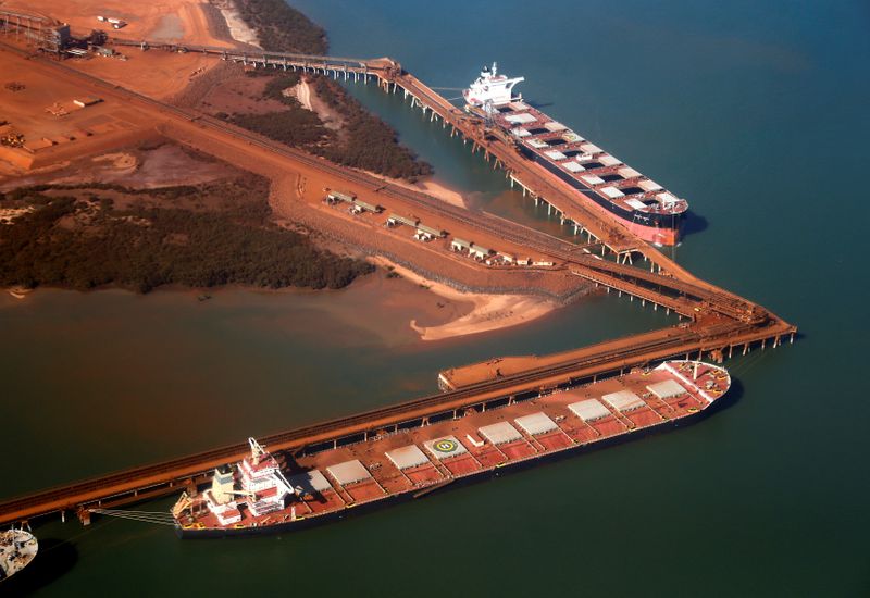 &copy; Reuters. FILE PHOTO: Ships waiting to be loaded with iron ore are seen at the Fortescue loading dock located at Port Hedland