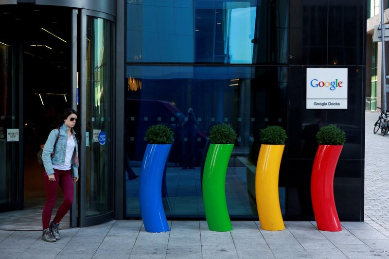 &copy; Reuters. FILE PHOTO: FILE PHOTO: A woman walks past the Google offices near the city centre in Dublin