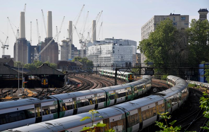 &copy; Reuters. Trains pass near construction work taking place around Battersea Power Station in London, Britain