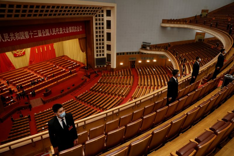 China's parliament to delay Hong Kong legislative vote, overhaul electoral system