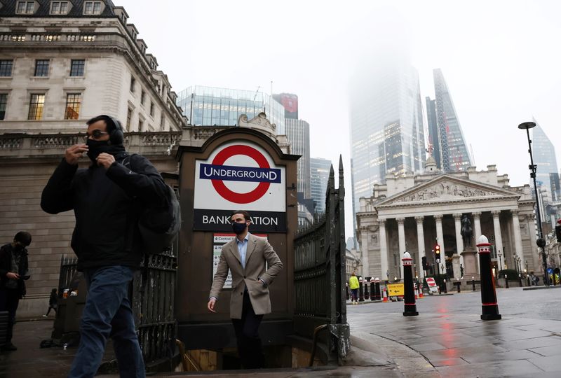 &copy; Reuters. People exit Bank station in the City of London financial district, amid the coronavirus disease (COVID-19) outbreak, in London