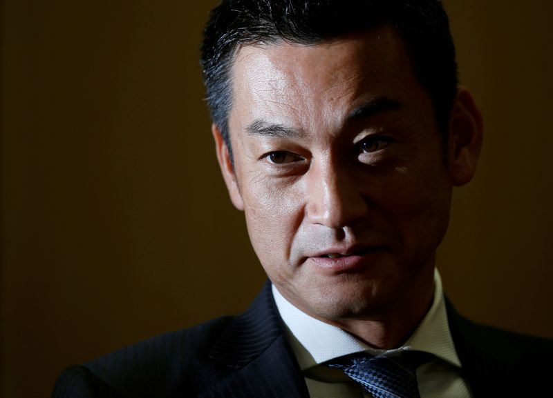 © Reuters. FILE PHOTO: Japan Post Bank Chief Investment Officer Katsunori Sago speaks during an interview for the Reuters Global Investment Outlook Summit in Tokyo