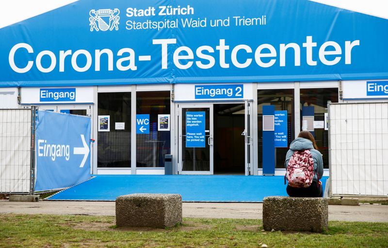 &copy; Reuters. A woman sits in front of a COVID-19 testing site of the Stadtspital Waid and Triemli hospital in Zurich