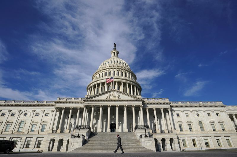 &copy; Reuters. FILE PHOTO: A man walks past the U.S. Capitol in Washington