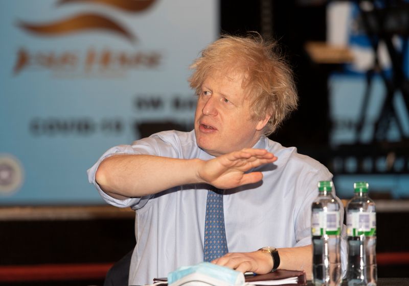 &copy; Reuters. Britain&apos;s Prime Minister Boris Johnson visits a COVID-19 vaccination centre, in London