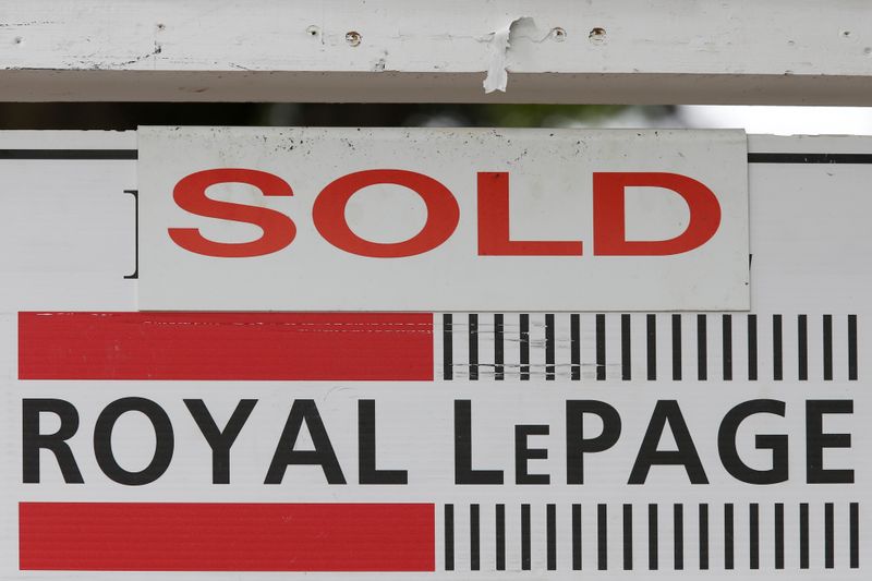 &copy; Reuters. FILE PHOTO: A Royal LePage real estate sign is marked &quot;Sold&quot; in front of a house in Ottawa