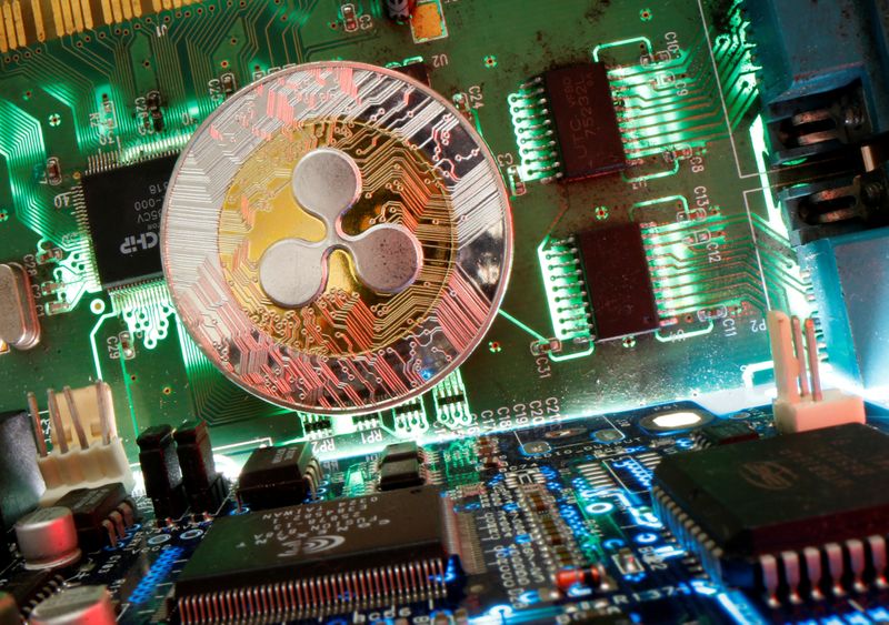 &copy; Reuters. Representation of the virtual currency Ripple coin is seen on a motherboard in this picture illustration