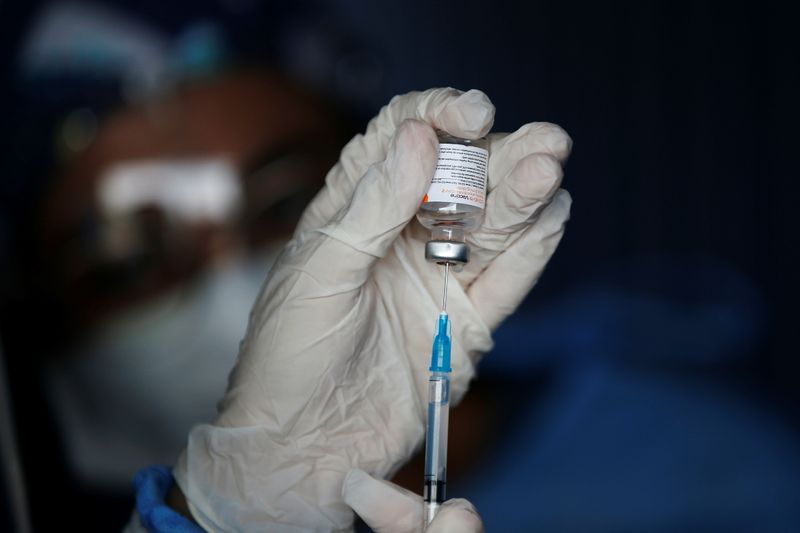 &copy; Reuters. Drive-thru mass vaccination for elderly people in Jakarta