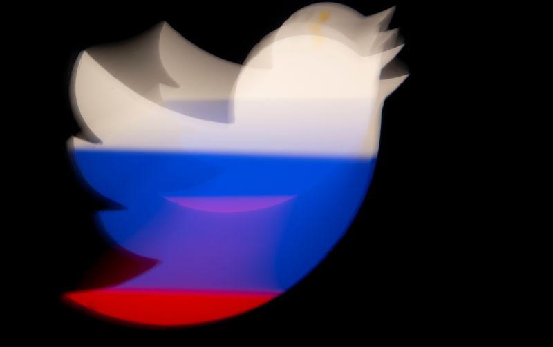 &copy; Reuters. A 3d printed Twitter logo is pictured in front of a Russian flag in this illustration