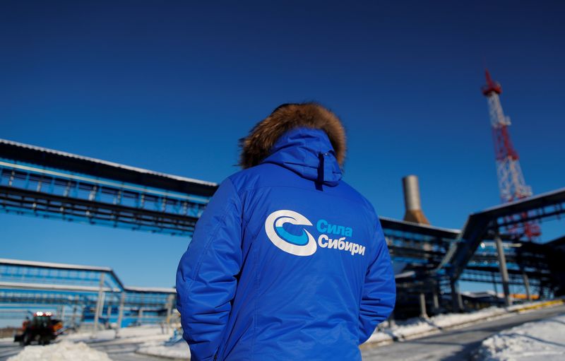 &copy; Reuters. An employee in branded jacket is seen at the Atamanskaya compressor station, facility of Gazprom&apos;s Power Of Siberia gas pipeline outside the far eastern town of Svobodny