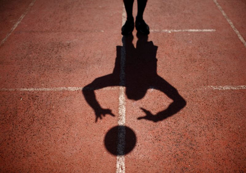 &copy; Reuters. FILE PHOTO: The shadow of a player is being cast on the ground during the first South Asia LGBT Sports Festival in Kathmandu