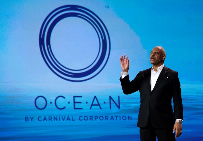 &copy; Reuters. FILE PHOTO: Arnold Donald, CEO of Carnival Corp., holds up the company&apos;s new Ocean Medallion, a small wearable for their cruise ship passengers, during his keynote address at CES in Las Vegas