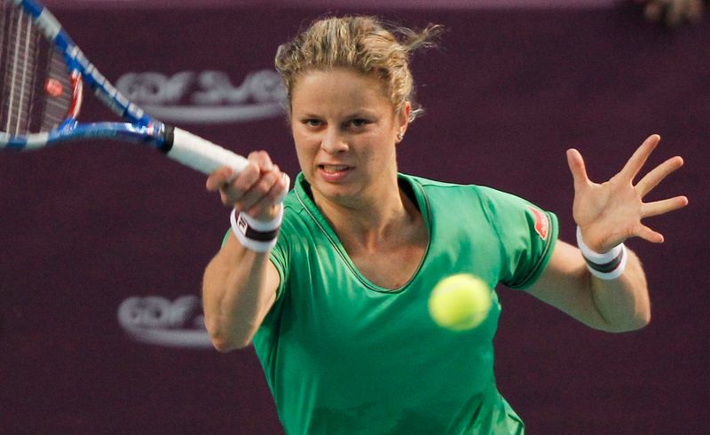 &copy; Reuters. Kim Clijsters of Belgium returns a shot to Jelena Dokic of Australia during their match at Paris Open tennis tournament