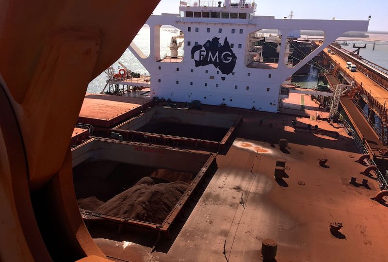 &copy; Reuters. FILE PHOTO: The logo of Australia&apos;s Fortescue Metals Group can be seen on a bulk carrier as it is loaded with iron ore at the coastal town of Port Hedland in Western Australia