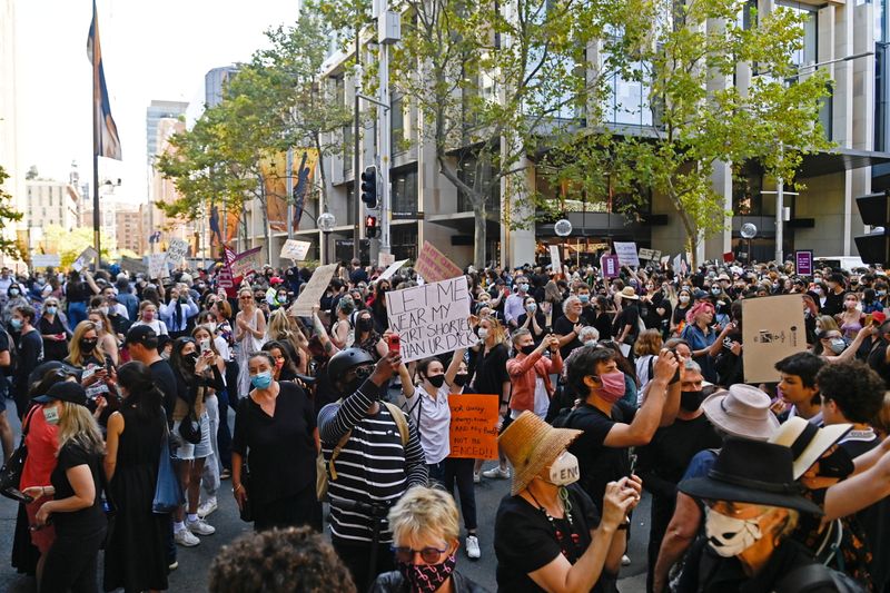 © Reuters. Protesters rally following sexual assault allegations in Australian government in Sydney