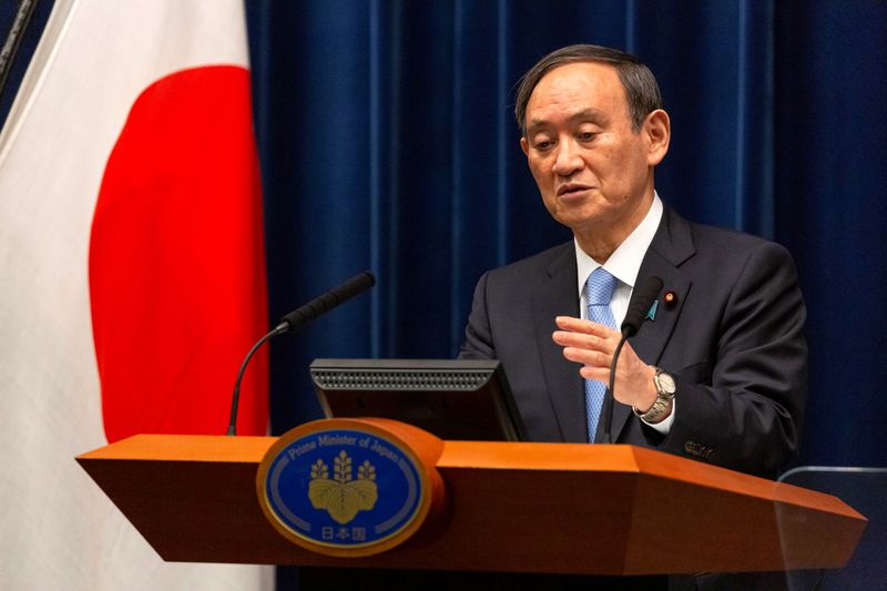 &copy; Reuters. 欧米前の菅首相らのワクチン接種は調整中＝加藤官房長官