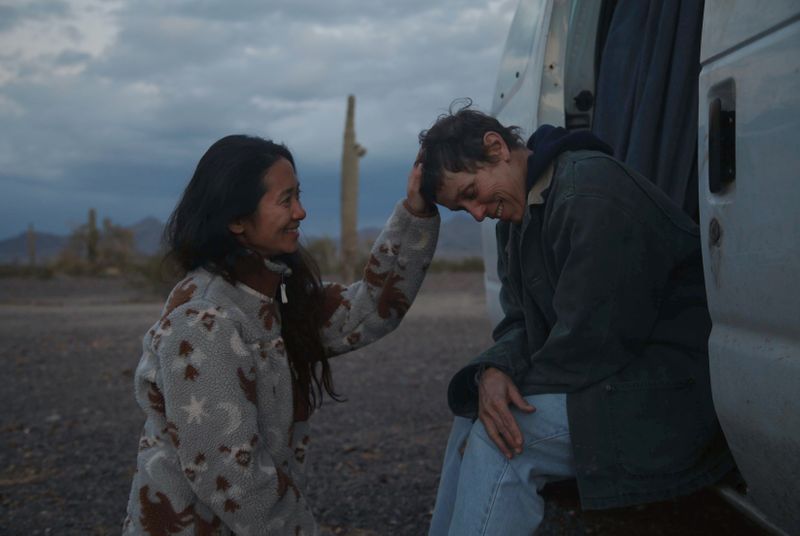 © Reuters. Director Chloe Zhao and Frances McDormand on the set of Nomadland