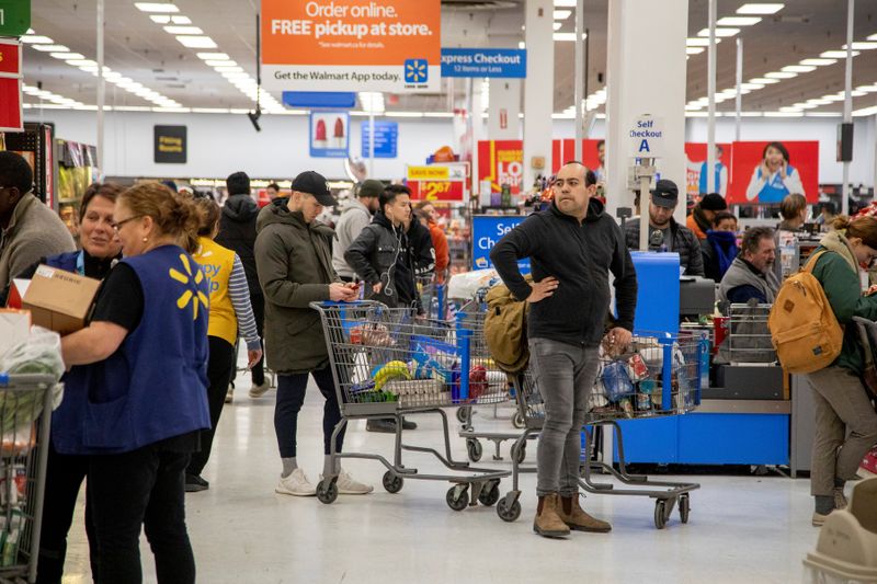 &copy; Reuters. People gather supplies at a grocery store amid coronavirus fears spreading in Toronto