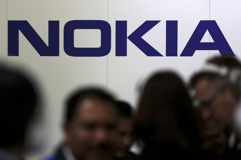 &copy; Reuters. Visitors gather outside the Nokia booth at the Mobile World Congress in Barcelona