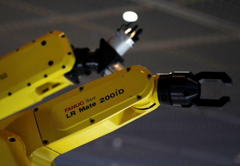 &copy; Reuters. FILE PHOTO: Fanuc Corp&apos;s machinery models are seen at Narita International airport terminal 1