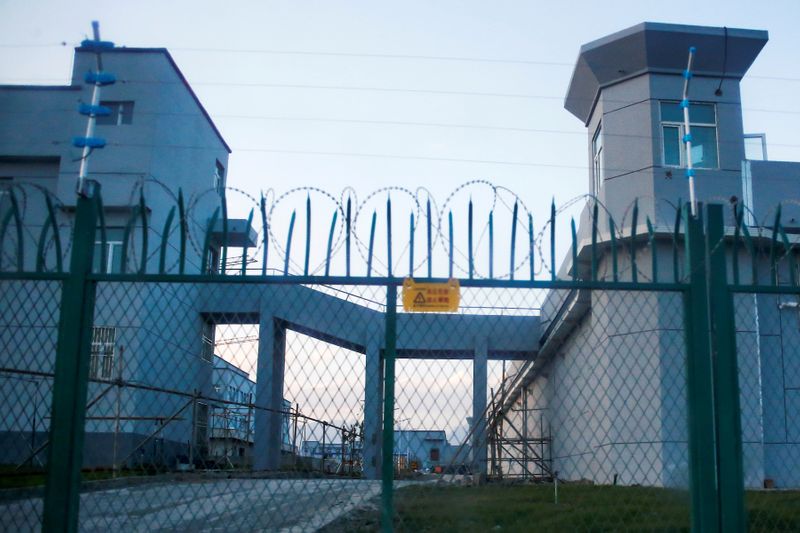 &copy; Reuters. FILE PHOTO: A perimeter fence is constructed around what is officially known as a vocational skills education centre in Dabancheng